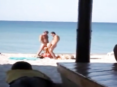 My slutty girlfriend blows two strangers at the public beach
