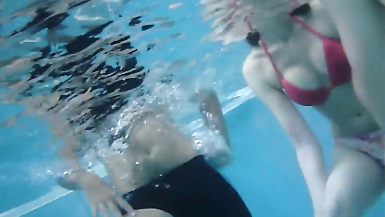Gorgeous babes fool around with their men in the pool
