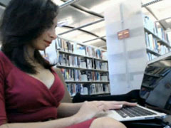 Gorgeous babe in a crimson dress makes public webcam tease
