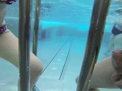 Charming girlfriend gives an underwater handjob