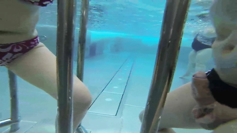 Charming girlfriend gives an underwater handjob
