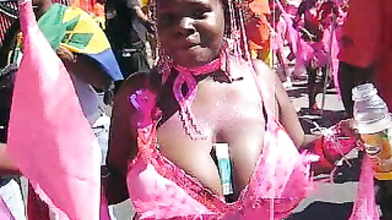 Big-breasted Brazilian scantily clad at a parade