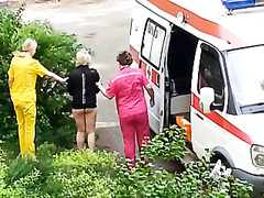 Ambulance picks up lady passed out in the grass