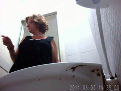 Chubby amateur mommy pisses in public toilet
