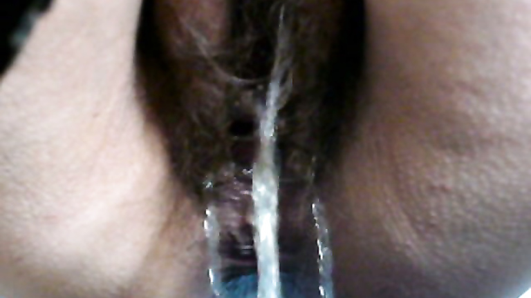 Hairy vagina has a quick piss in close up video