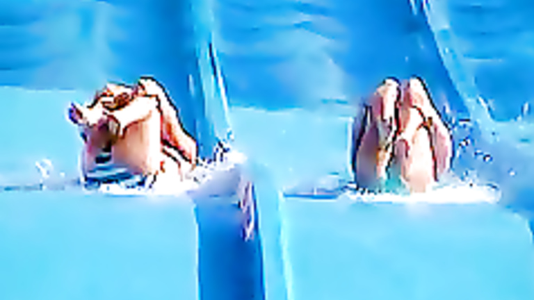 Tiny tits and ass exposed on the waterslide