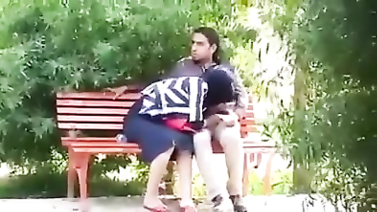 Turkish girl in hijab gives a blowjob to her friend in the city park