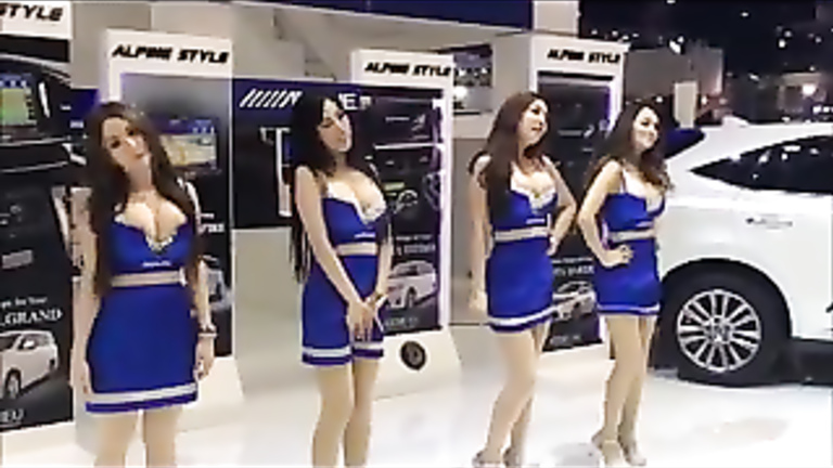 Busty babes dancing at the car fair