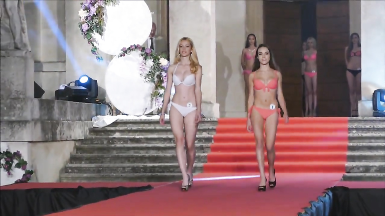 Beautiful young models get out on the catwalk in sexy bikinis