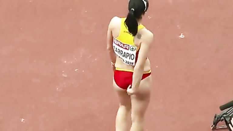 Raven-haired athletic babe competes in long jump