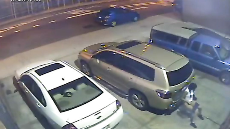 Security camera catches a girl peeing behind a car