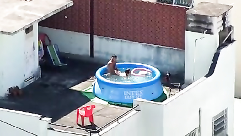 My horny neighbors caught having sex in the pool