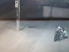 Female motorcyclist gets caught on security cam urinating