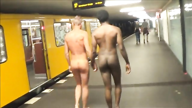 Gay exhibitionists walk naked down street