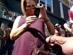 Exhibitionist man with his cock out at a street festival