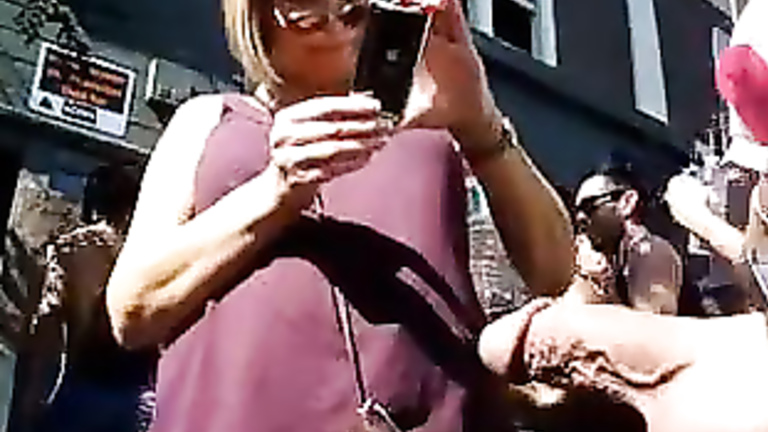 Exhibitionist man with his cock out at a street festival