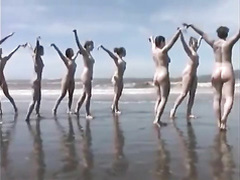 Naked performance art on the beach