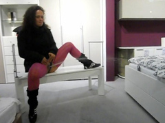 Naughty German beauty peeing in the furniture store