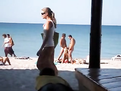 Craziest exhibitionist girl sucks two penises on the Crimean coast
