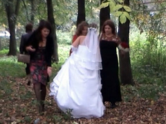 Russian bride and her bridesmaids pee in the woods