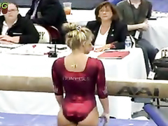 Female gymnast with a powerful ass in a shiny leotard