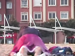 Rubbing the pussy on boyfriend's cock on the public beach