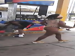 Ebony woman exposes her curves at the gas station