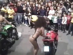 Bike washing competition with sexy babes in swimsuits