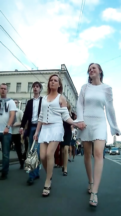 Short white skirts on beauties walking the city