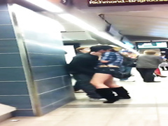 Fooling around with his GF at the metro stop
