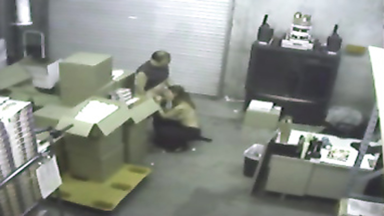 Boss blows the warehouse worker on security camera