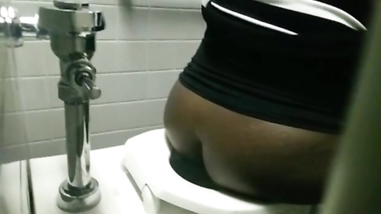 Spying on a black BBW pissing in a public toilet